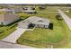 Beautiful new home with green lawn, and a long driveway in a well-maintained neighborhood at 16031 Hesta Misty Ct, Punta Gorda, FL 33955