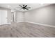 Bright bedroom featuring a modern ceiling fan, hard flooring, and neutral wall color at 16031 Hesta Misty Ct, Punta Gorda, FL 33955