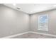 Cozy bedroom with wood floors, a large window, and neutral paint at 16031 Hesta Misty Ct, Punta Gorda, FL 33955