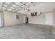 Spacious garage with concrete floor, overhead door, and utility connections; ready for customization and storage at 16031 Hesta Misty Ct, Punta Gorda, FL 33955