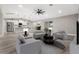 Cozy living room complemented by an open-concept kitchen and a comfortable seating area at 16031 Hesta Misty Ct, Punta Gorda, FL 33955