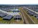 Aerial view of a house and surrounding neighborhood at 16255 Lady Palm Dr, Port Charlotte, FL 33953