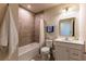 Clean bathroom with a tub, toilet, and vanity at 16255 Lady Palm Dr, Port Charlotte, FL 33953