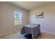 Spacious bedroom with a large window and neutral decor at 16255 Lady Palm Dr, Port Charlotte, FL 33953