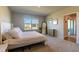 Bright bedroom with window, carpet, and access to patio at 16255 Lady Palm Dr, Port Charlotte, FL 33953