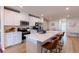 Modern kitchen with white cabinets, stainless steel appliances and large island at 16255 Lady Palm Dr, Port Charlotte, FL 33953