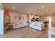 Open concept living room with hardwood floors and a view of the kitchen at 16255 Lady Palm Dr, Port Charlotte, FL 33953