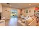 Spacious living room with sliding glass doors to backyard at 16255 Lady Palm Dr, Port Charlotte, FL 33953