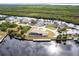 Aerial view of waterfront home with private dock and pool at 16920 Ohara Dr, Port Charlotte, FL 33948