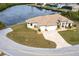 Property showcasing a large home with a paved driveway at 16920 Ohara Dr, Port Charlotte, FL 33948
