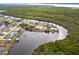 Bird's-eye view of canal-front home and neighborhood at 16920 Ohara Dr, Port Charlotte, FL 33948