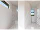 Bathroom with marble flooring and walk-in shower at 16920 Ohara Dr, Port Charlotte, FL 33948
