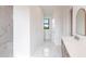 Modern bathroom with double vanity and marble flooring at 16920 Ohara Dr, Port Charlotte, FL 33948