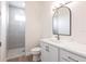 Modern bathroom with a walk-in shower and quartz countertop at 16920 Ohara Dr, Port Charlotte, FL 33948