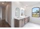 Elegant bathroom with double vanity and marble flooring at 16920 Ohara Dr, Port Charlotte, FL 33948