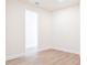 Simple bedroom with light walls and wood-look floors at 16920 Ohara Dr, Port Charlotte, FL 33948