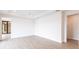 Large bedroom with wood-look floors and an ensuite bathroom at 16920 Ohara Dr, Port Charlotte, FL 33948