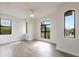 Spacious bedroom with large windows and hardwood floors at 16920 Ohara Dr, Port Charlotte, FL 33948