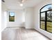 Bright bedroom with hardwood floors and large windows at 16920 Ohara Dr, Port Charlotte, FL 33948