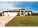 Beautiful one-story home with three-car garage, and landscaped yard at 16920 Ohara Dr, Port Charlotte, FL 33948