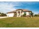 One story home with a three car garage and nicely landscaped yard at 16920 Ohara Dr, Port Charlotte, FL 33948