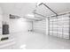 Bright and spacious two-car garage with epoxy flooring and ample storage at 16920 Ohara Dr, Port Charlotte, FL 33948