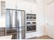 Stainless steel appliances built into white cabinets in this modern kitchen at 16920 Ohara Dr, Port Charlotte, FL 33948