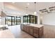 Open concept kitchen with island, stainless steel appliances & water view at 16920 Ohara Dr, Port Charlotte, FL 33948