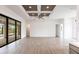 Bright living room with wood-look floors and sliding glass doors leading to the outdoors at 16920 Ohara Dr, Port Charlotte, FL 33948