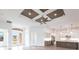 Open living space with high ceilings, coffered accents, and hardwood floors at 16920 Ohara Dr, Port Charlotte, FL 33948