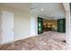 Spacious covered patio with sliding doors opening to the kitchen and pool area at 16920 Ohara Dr, Port Charlotte, FL 33948