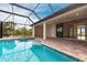 Stunning screened pool and spa overlooking the tranquil water at 16920 Ohara Dr, Port Charlotte, FL 33948