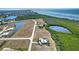 Aerial view of property showcasing waterfront location and surrounding homes at 17455 Boca Vista Rd, Punta Gorda, FL 33955