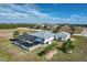 Aerial view showcasing home, pool, and surrounding landscape at 17455 Boca Vista Rd, Punta Gorda, FL 33955