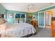 Spacious bedroom with a comfortable bed and French doors leading outside at 17455 Boca Vista Rd, Punta Gorda, FL 33955
