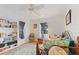 Bright bedroom with daybed, built-in shelving, and hardwood floors at 17455 Boca Vista Rd, Punta Gorda, FL 33955