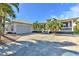 House exterior showcasing front porch, driveway, and landscaping at 17455 Boca Vista Rd, Punta Gorda, FL 33955