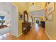 Bright hallway with hardwood floors and decorative mirror at 17455 Boca Vista Rd, Punta Gorda, FL 33955