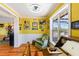 Sunlit home office with built-in desk and view into adjacent living area at 17455 Boca Vista Rd, Punta Gorda, FL 33955