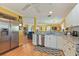 Open concept kitchen, stainless steel appliances, granite counters at 17455 Boca Vista Rd, Punta Gorda, FL 33955