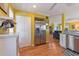Kitchen boasts stainless steel refrigerator and hardwood floors at 17455 Boca Vista Rd, Punta Gorda, FL 33955