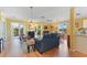 Open living room with hardwood floors, yellow walls, and comfy seating at 17455 Boca Vista Rd, Punta Gorda, FL 33955