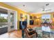 Living room with hardwood floors and view of the pool at 17455 Boca Vista Rd, Punta Gorda, FL 33955