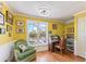 Home office with built-in shelving, hardwood floors and window seat at 17455 Boca Vista Rd, Punta Gorda, FL 33955