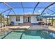 Screened pool with patio furniture and house access at 17455 Boca Vista Rd, Punta Gorda, FL 33955