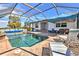 Enjoy this refreshing pool with a screened enclosure and patio furniture at 17455 Boca Vista Rd, Punta Gorda, FL 33955