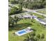 Aerial view of a well maintained home with large lot, above ground pool and pool house at 181 Coconut St, Punta Gorda, FL 33980