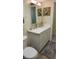 Bathroom features a white vanity, mirror, and light fixture at 181 Coconut St, Punta Gorda, FL 33980