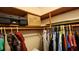 Spacious walk-in closet with wood shelving and ample storage, perfect for organization and convenience at 181 Coconut St, Punta Gorda, FL 33980
