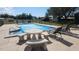 Community pool with lounge chairs, tables, and covered pool at 181 Coconut St, Punta Gorda, FL 33980
